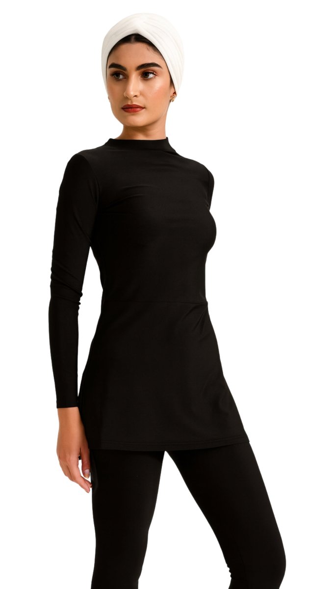 Modest black swim top styled with swim leggings Bare Essentials Dubai