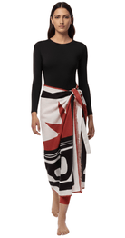 Burnt orange linen pareo long wrap styled over modest swimwear for elegant beach coverage.