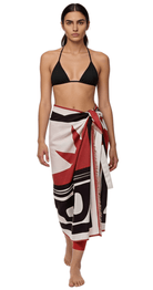 Burnt orange linen pareo sarong wrap worn over bikini as lightweight beach cover-up.