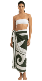 Olive green linen pareo long sarong wrap worn over bikini as lightweight beach cover-up.